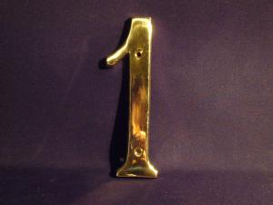 brass sign “1”