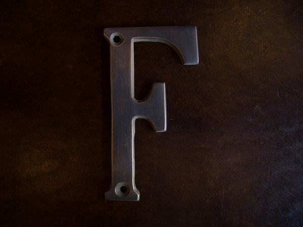 Brass Sign F