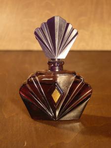 purple glass filled perfume bottle