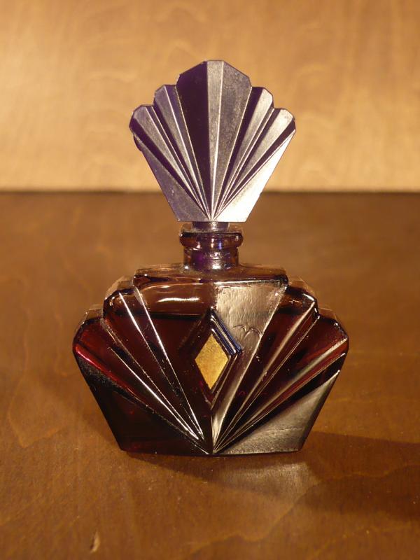 purple glass filled perfume bottle
