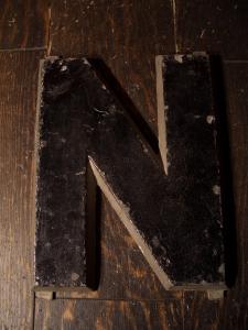 black sign “N”