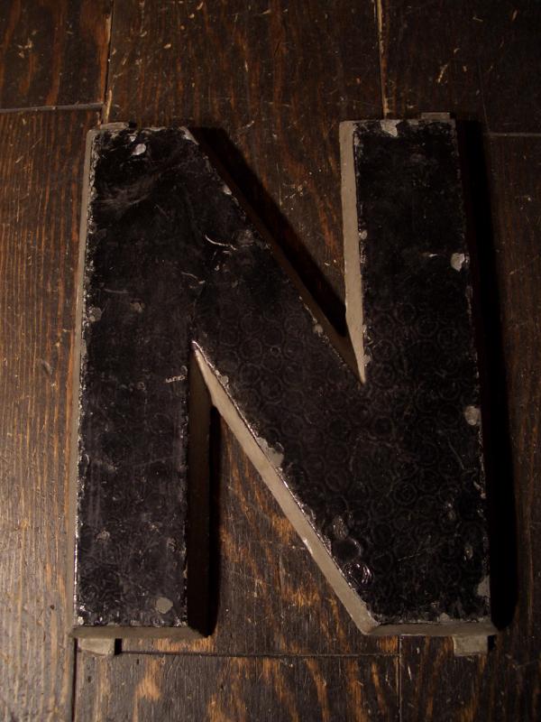 black sign “N”