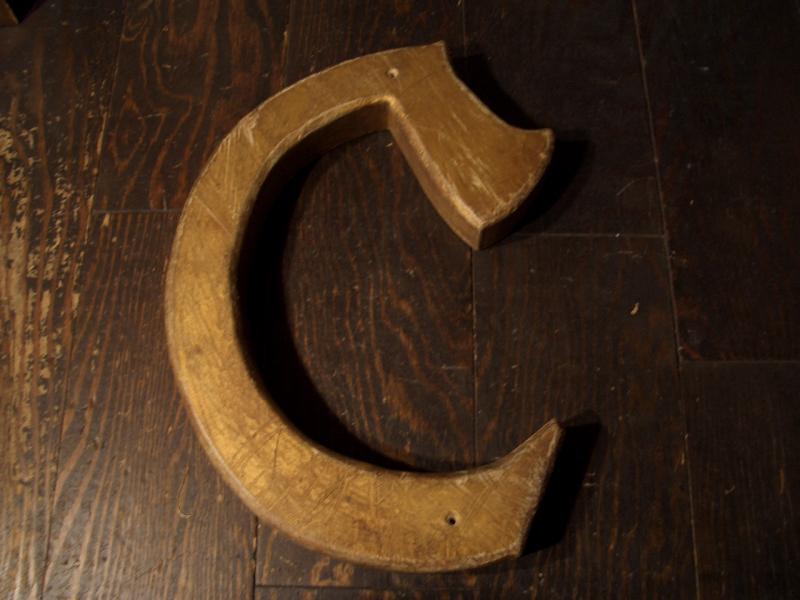 wood sign “C”