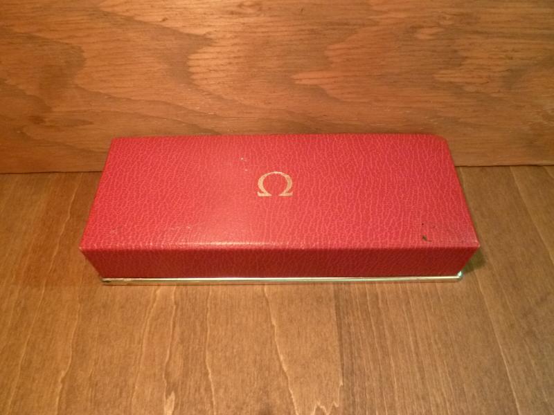 red OMEGA watch display case