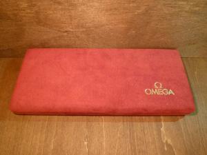 red OMEGA watch display case