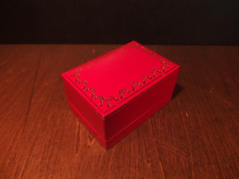 red Cartier watch display case