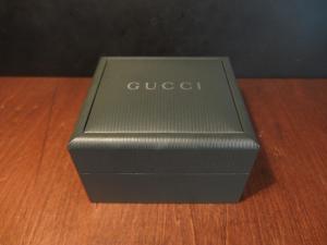 green GUCCI watch display case