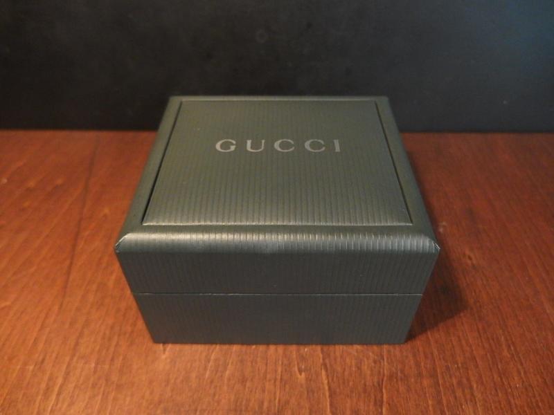 green GUCCI watch display case