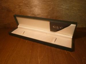 green GUCCI watch display case