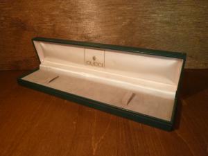 green GUCCI watch display case