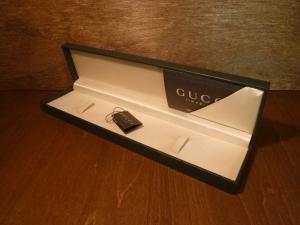 green GUCCI watch display case