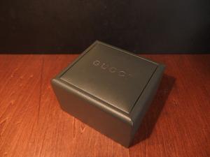 green GUCCI watch display case