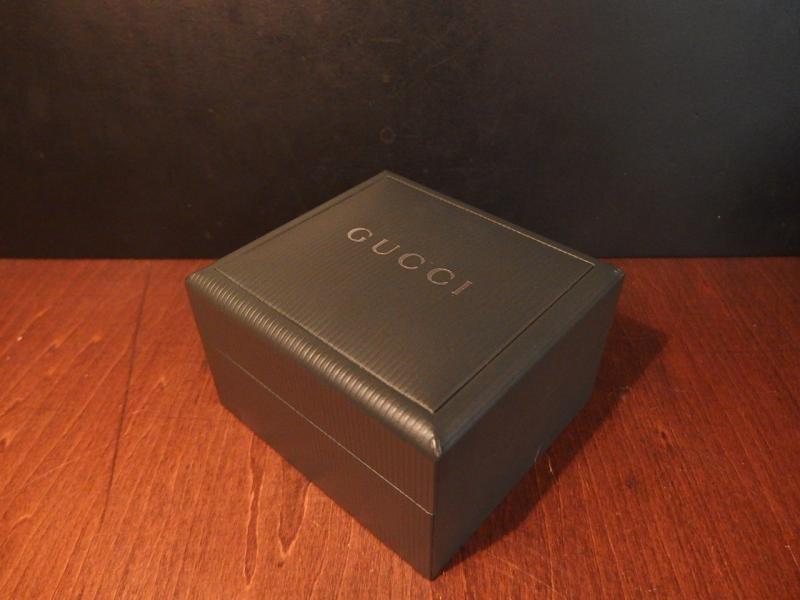 green GUCCI watch display case