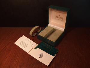 green GUCCI watch display case