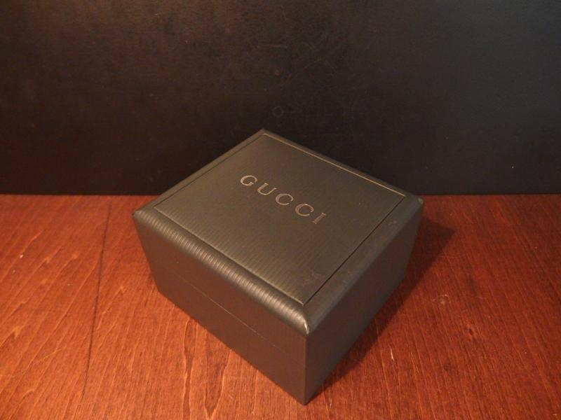 green GUCCI watch display case