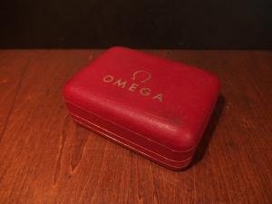 red OMEGA watch display case