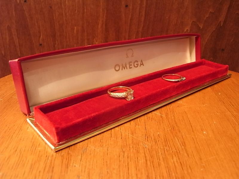 red OMEGA watch display case