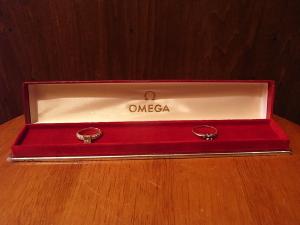 red OMEGA watch display case