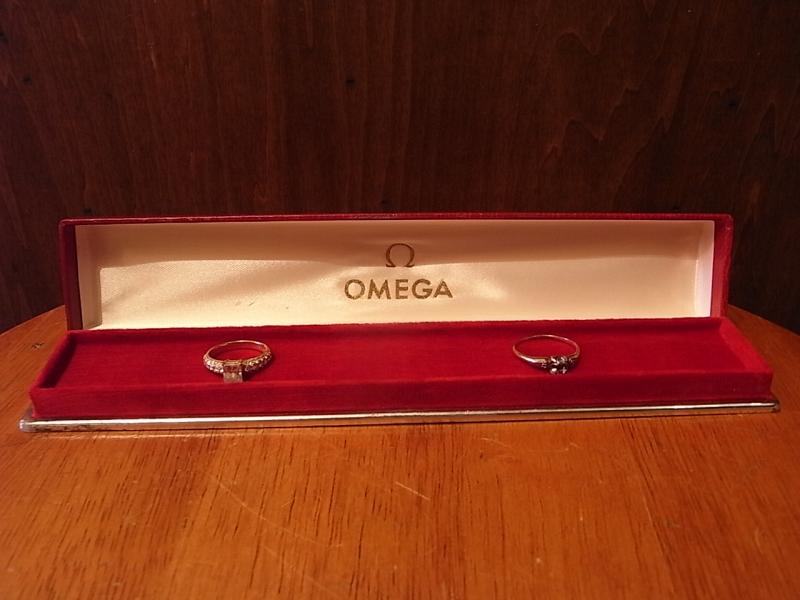 red OMEGA watch display case