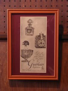 Guerlain perfume bottle advertisement poster
