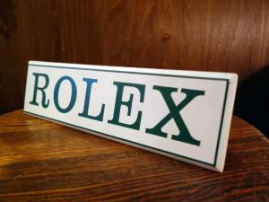 white ROLEX display plate stand
