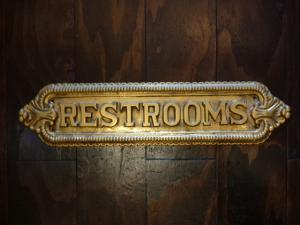 Italian brass RESTROOMS sign plate