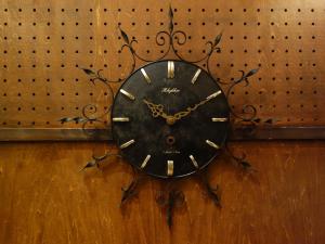 black sunburst wall clock