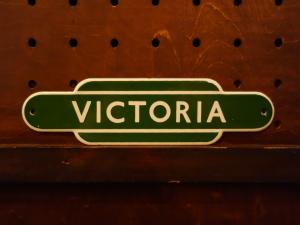 English green VICTORIA station sign plate
