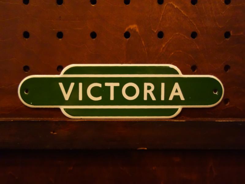 English green VICTORIA station sign plate