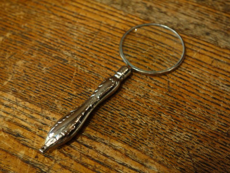 silver magnifying glass